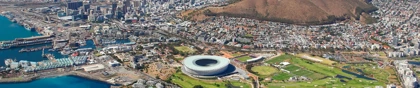 Aerial view of Cape Town with Table Mountain, Cape Town Stadium, and the coastline