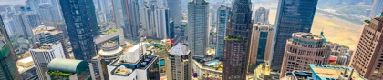 Chongqing skyline with modern skyscrapers and green urban spaces under a clear sky